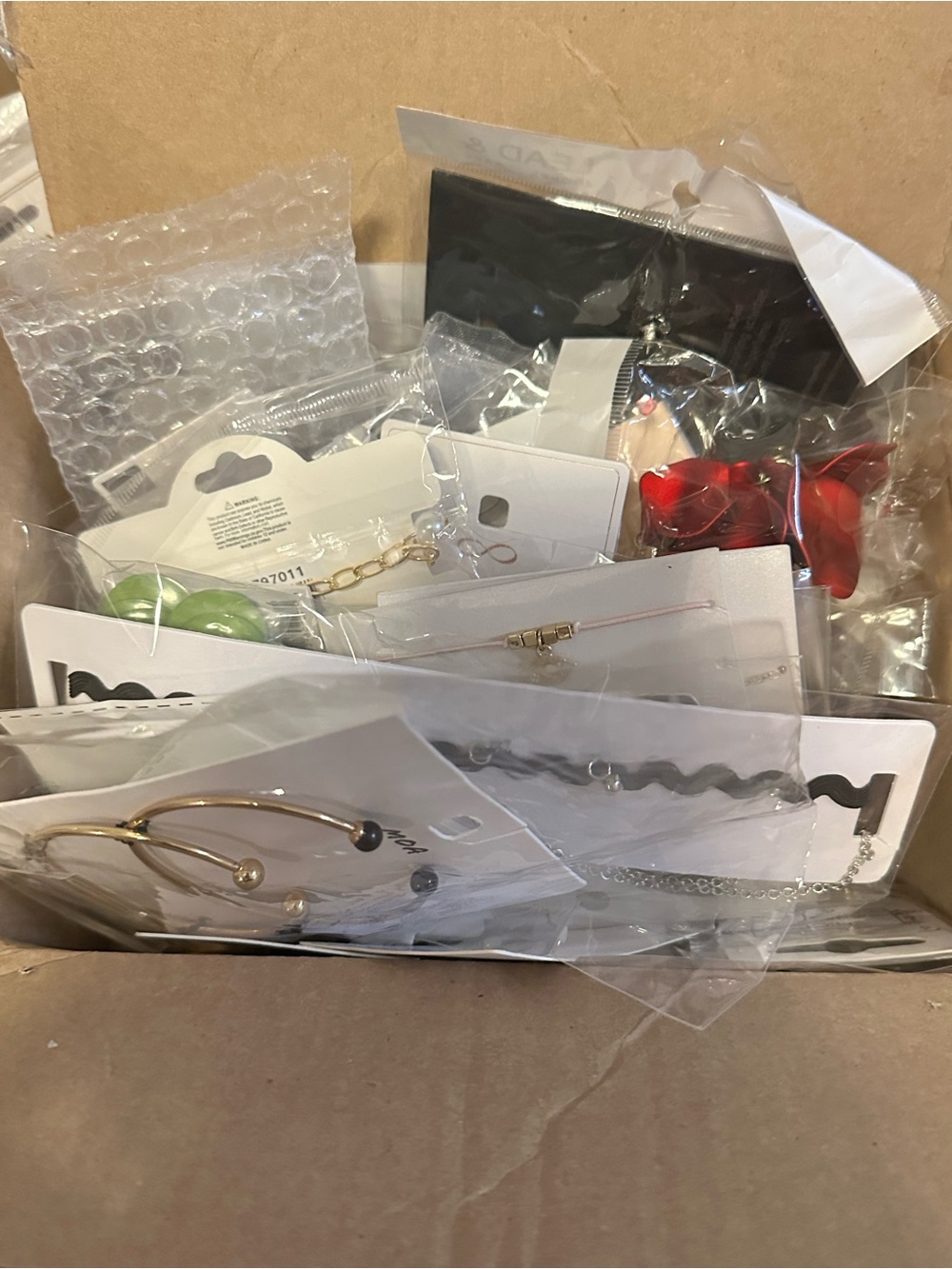 Gold and silver jewelry lot.  Has over 60 pieces of wearable items